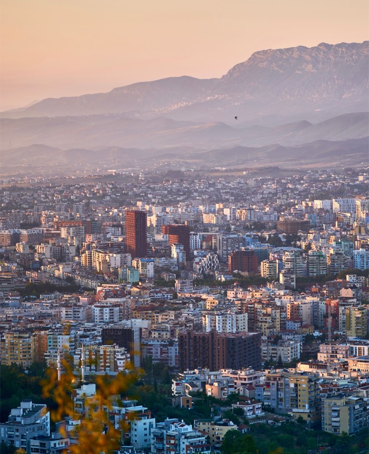 Tirana at dusk with the Dajti mountains behind the city